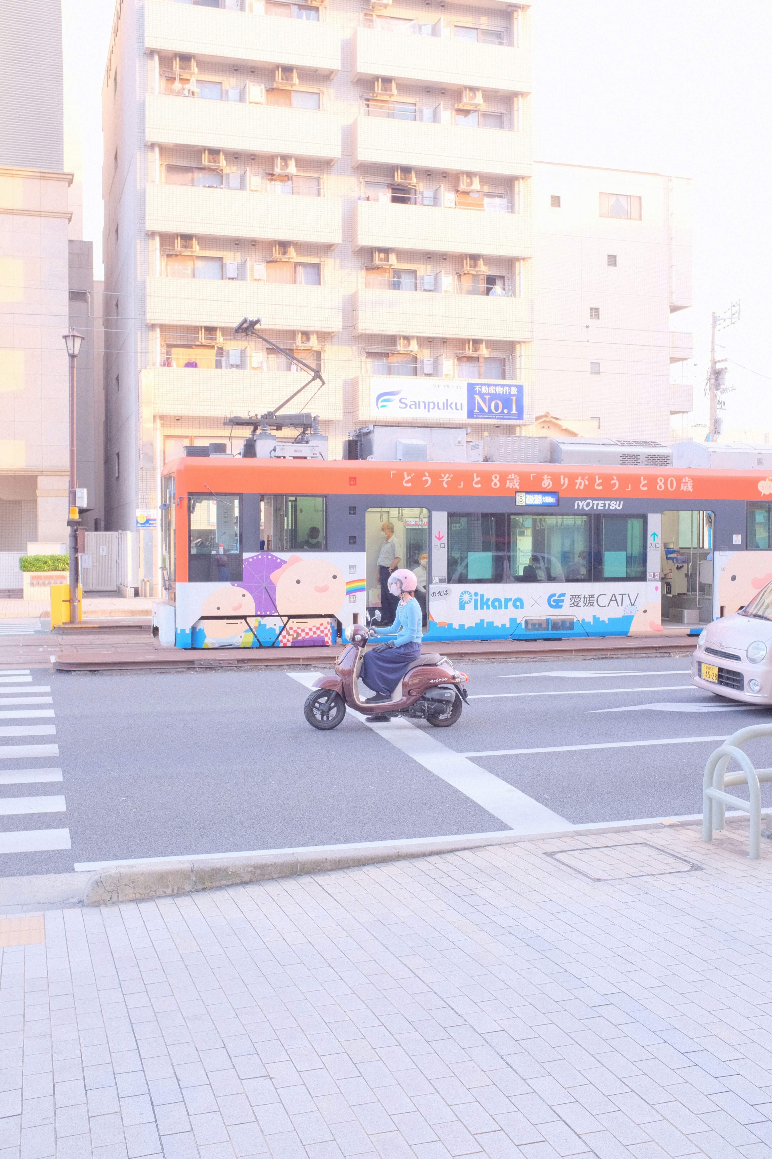 man in black jacket riding bicycle on road during daytime